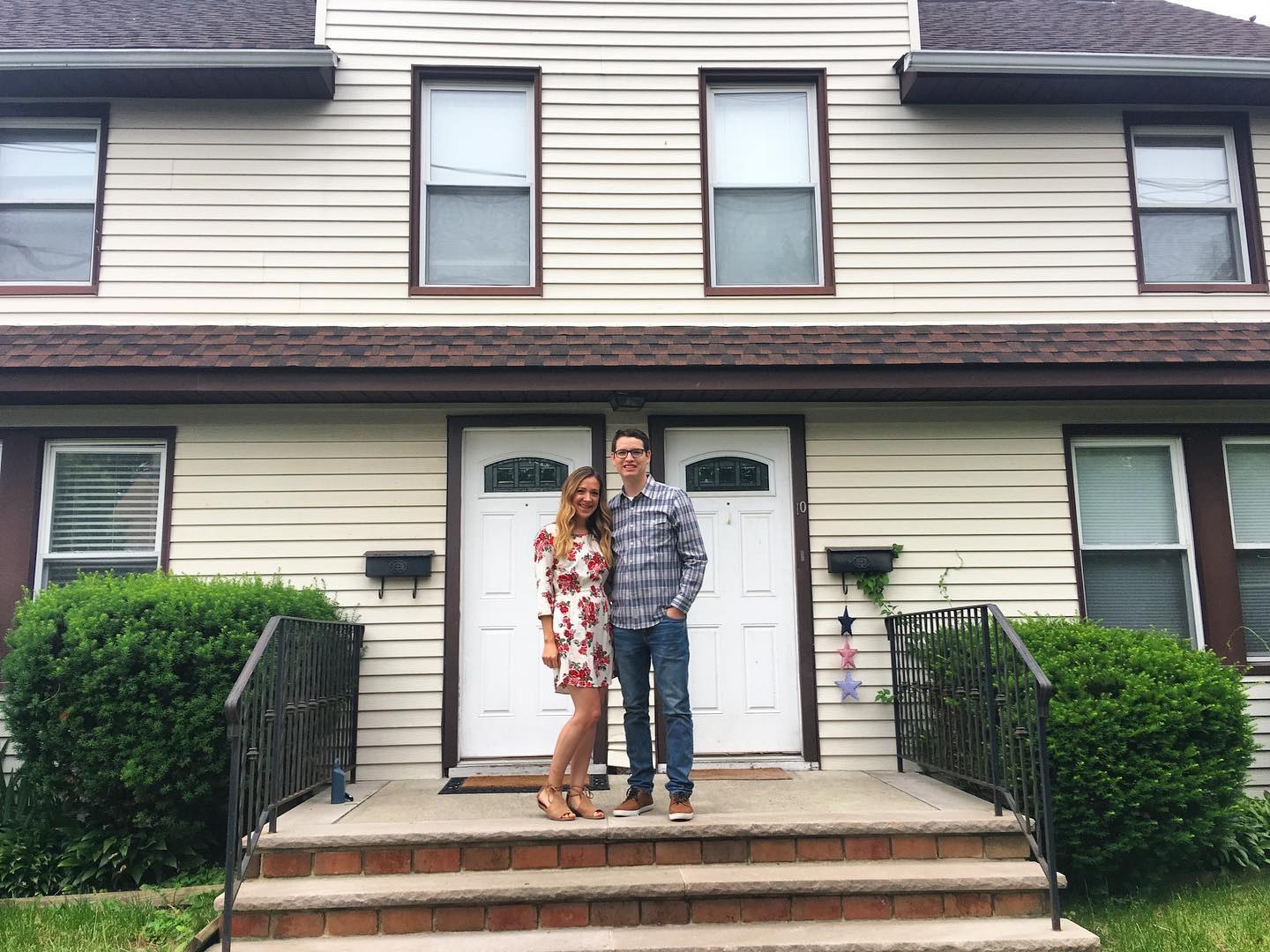 Justin and Steph in front of their first investment property on Stiles Ave, Morris Plains: a duplex with two front doors.